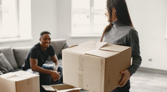 portrait-young-couple-with-cardboard-boxes-new-home-moving-house-concept_1157-47984